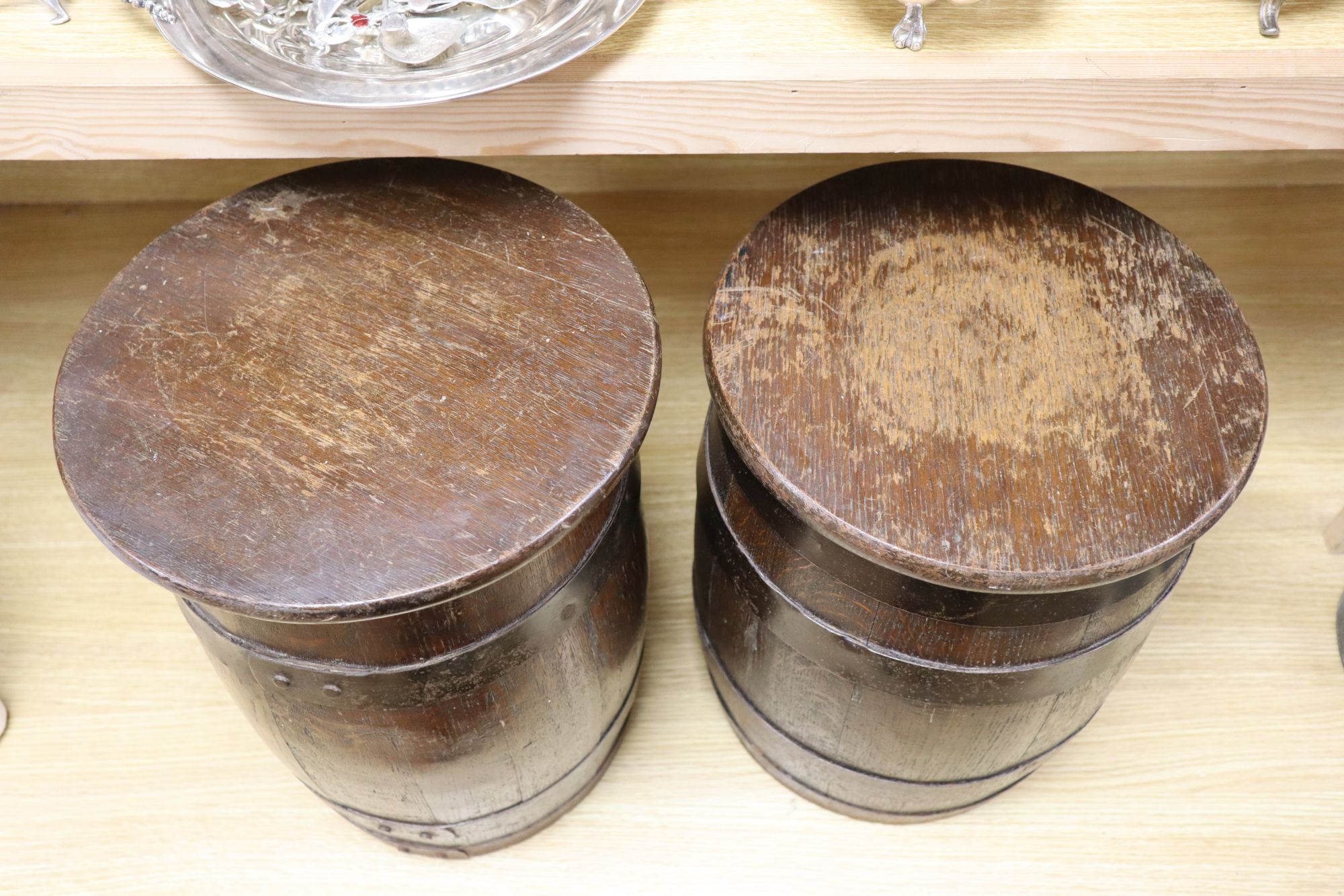 Two coopered oak sherry barrels (converted as small tables), height 39cm